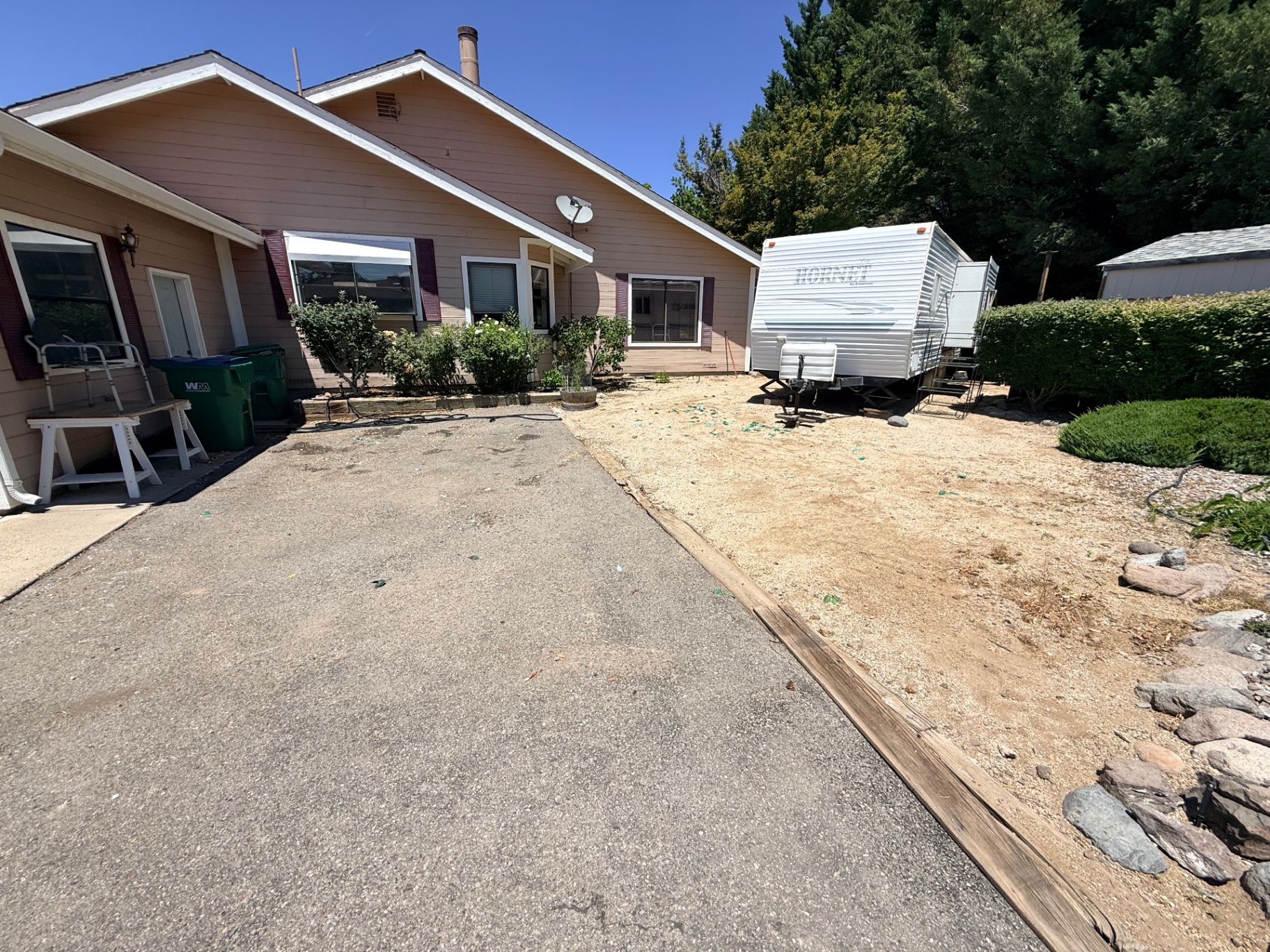 Same driveway cleared of furniture and junk after removal