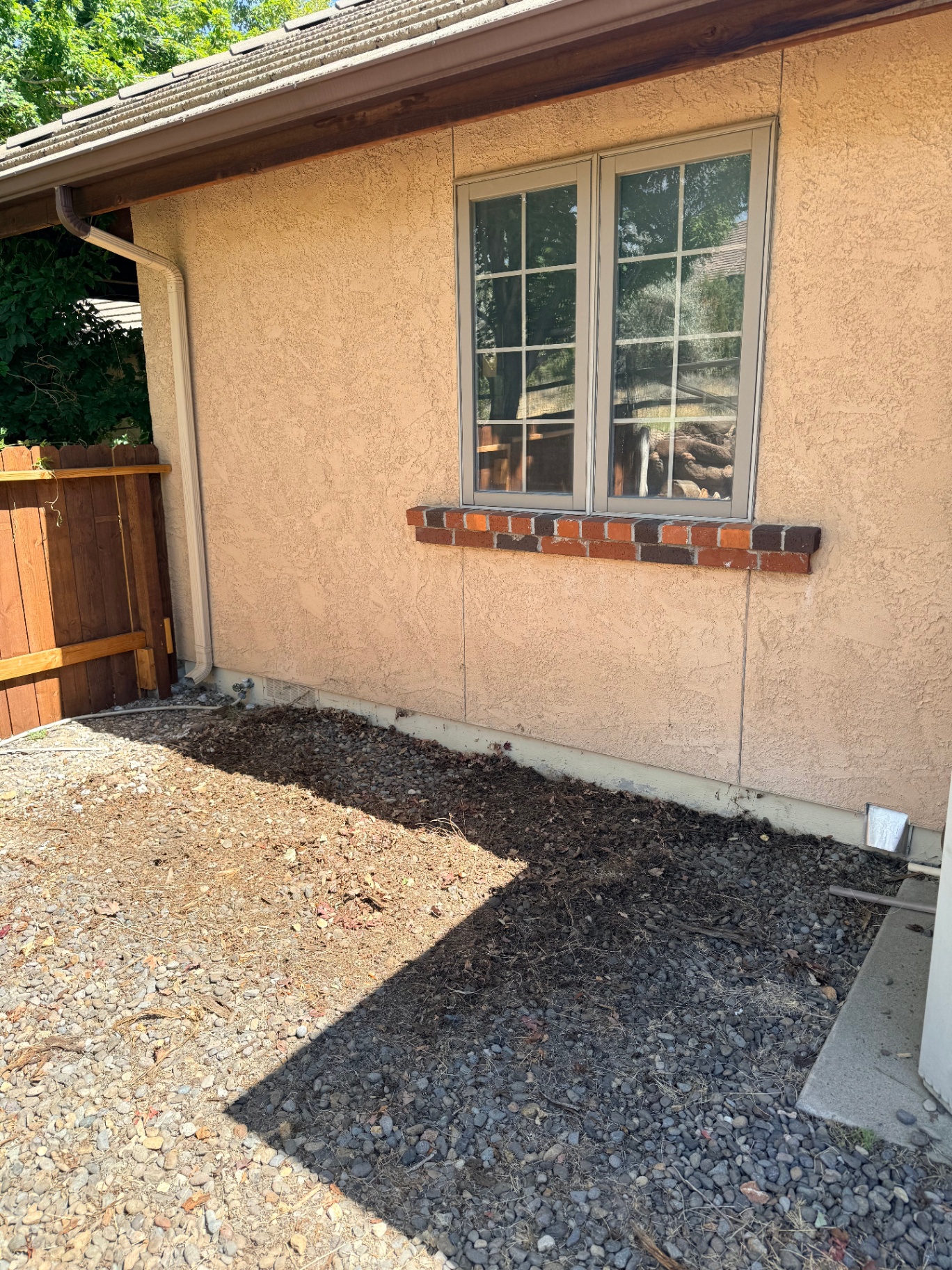 Same area beside the house cleared of wood debris
